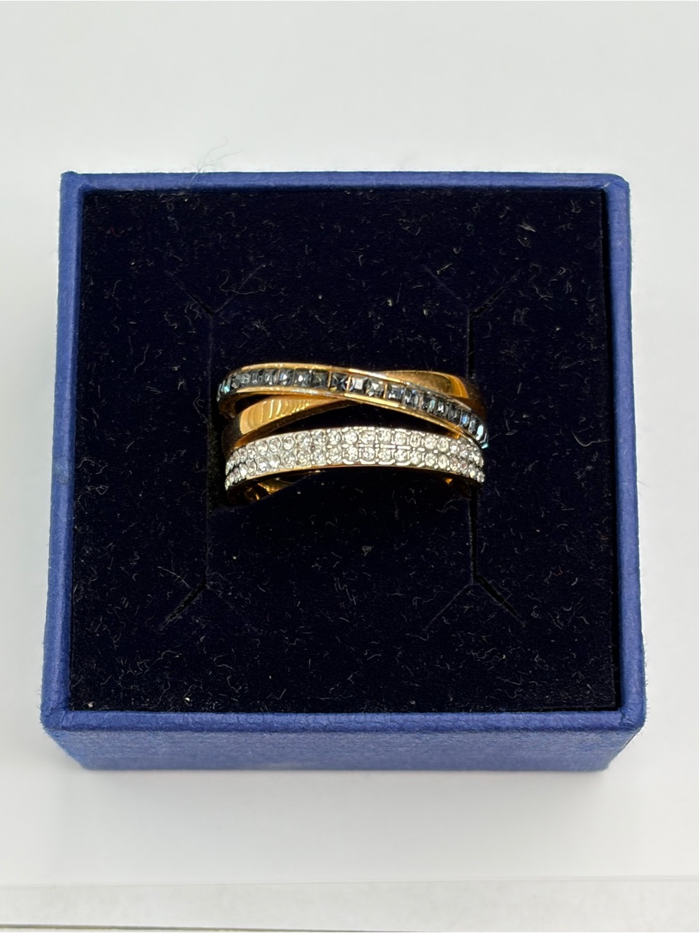 Swarovski Hint Mixed Gold-Plated Triple Ring band with black and clear crystals.